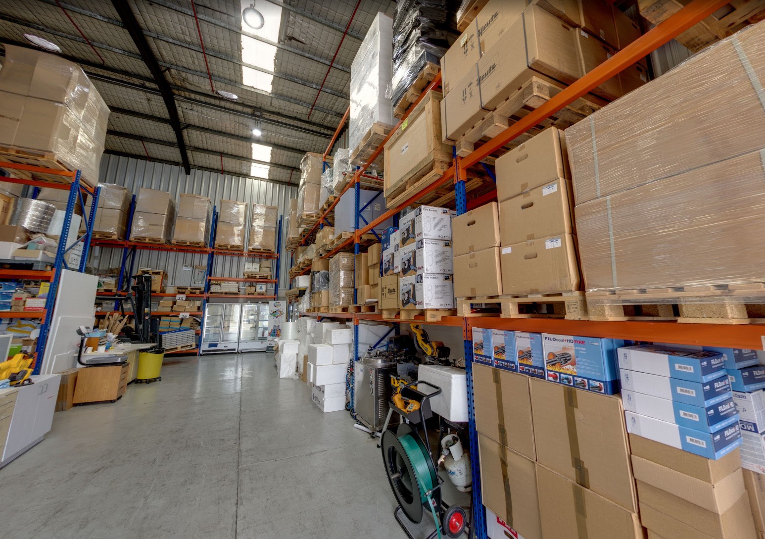 Inside the FMCG Industry Solutions warehouse in Caringbah showing pallet racking stocked with hygiene and food safety products